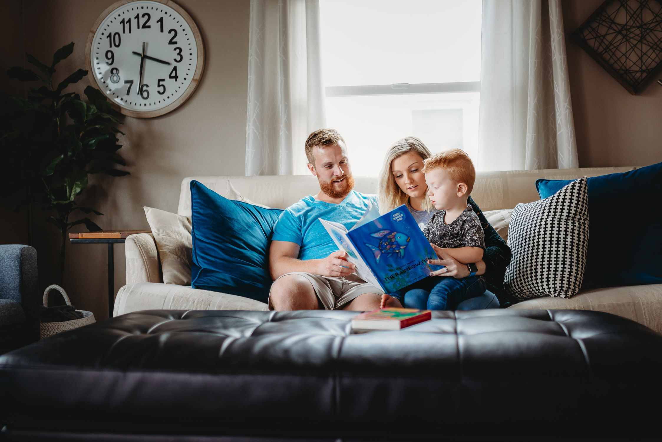 lifestyle photography session of family reading together on couch