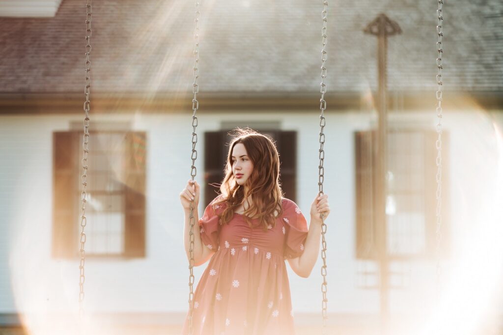 Senior photo on swings in quad cities